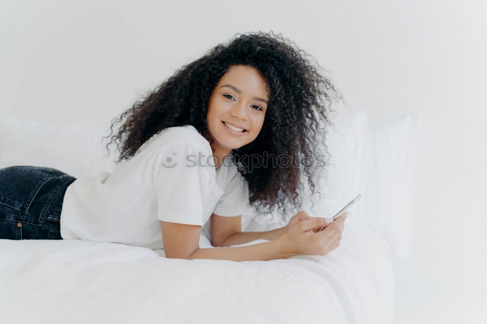 Similar – Happy beautiful young black woman relaxed sitting in the bed