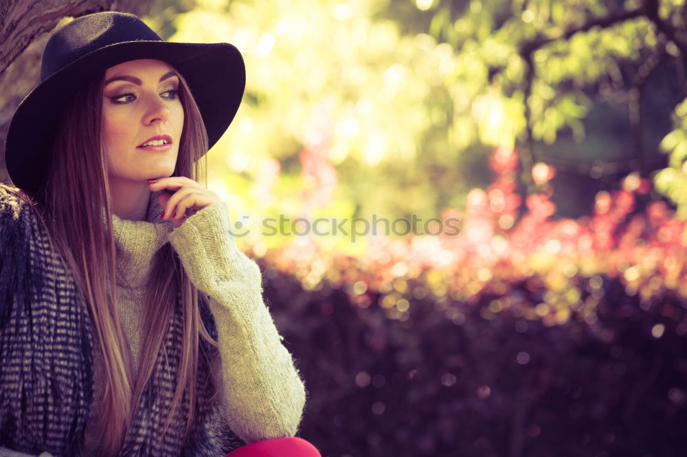 Similar – smiling young woman wearing winter coat with fake fur hood