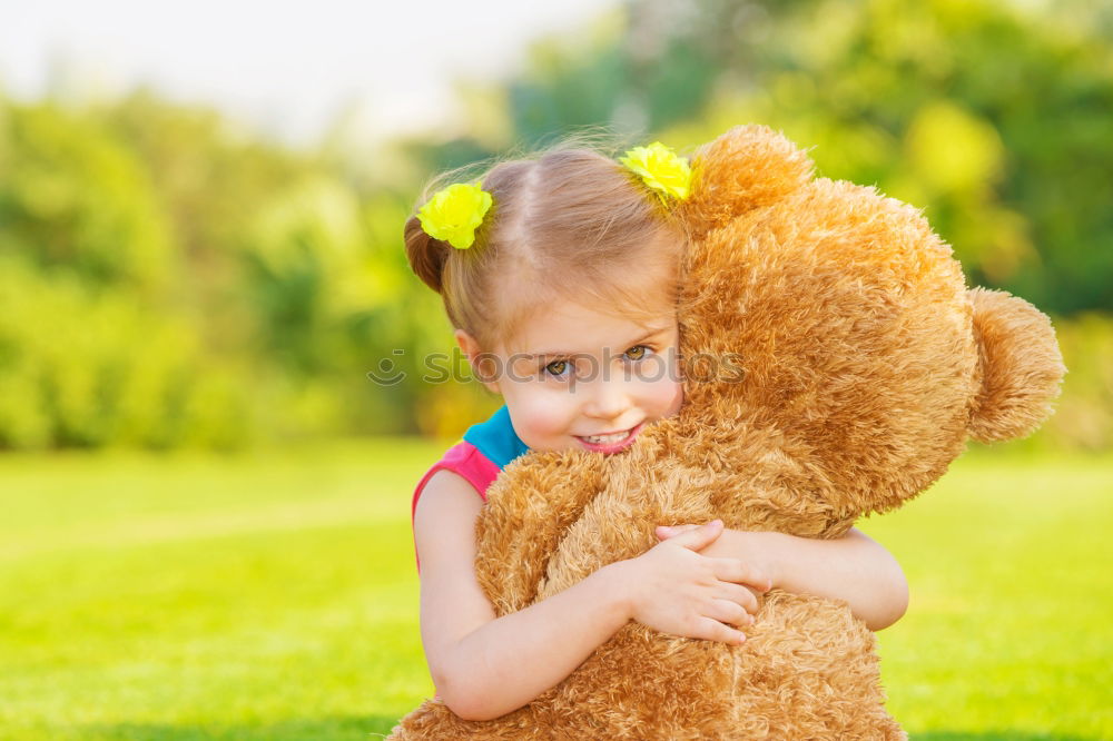 Similar – Young girl cuddles stuffy