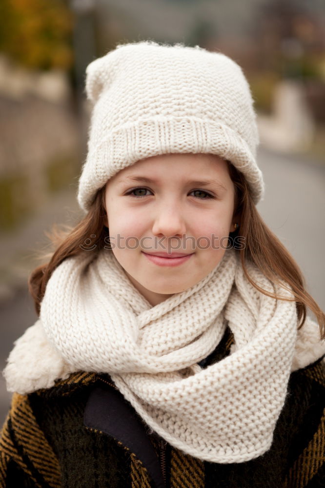 Pretty girl with wool hat in a park