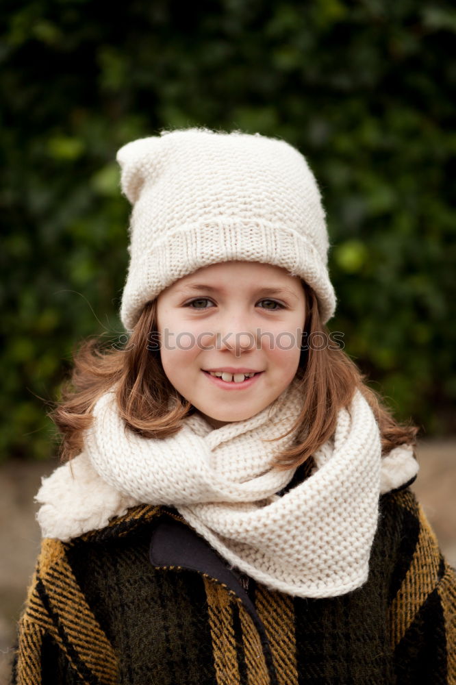 Similar – Pretty girl with wool hat in a park