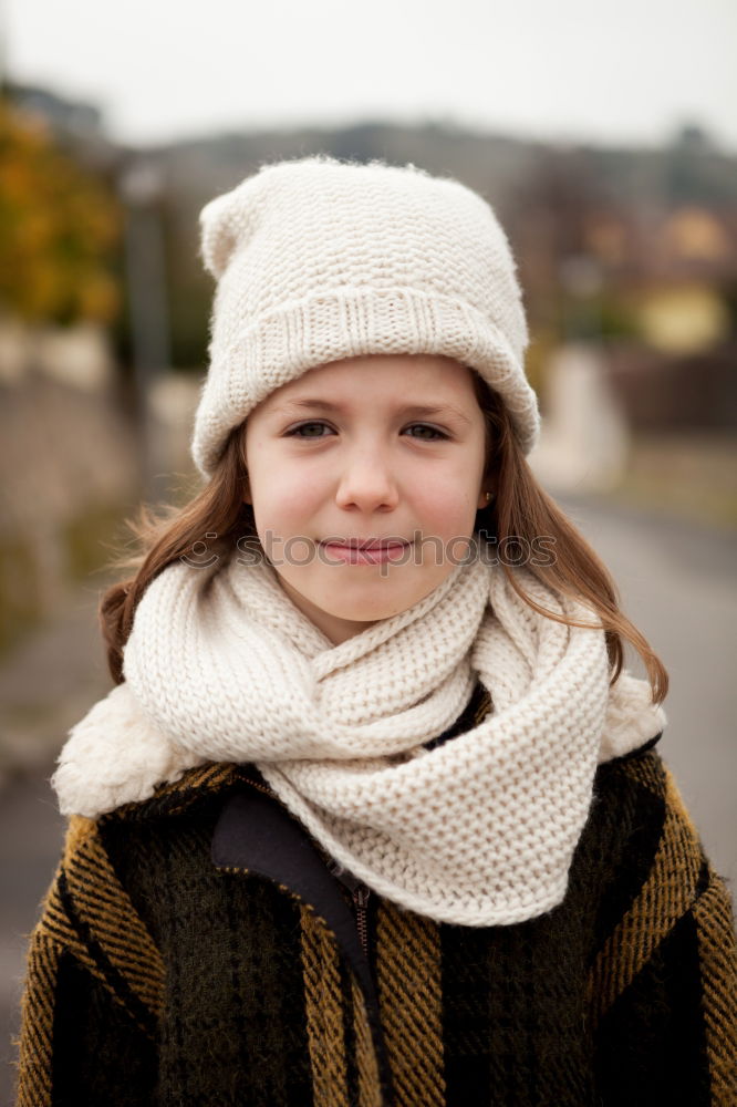 Similar – Pretty girl with wool hat in a park