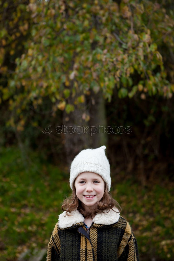 Similar – Image, Stock Photo Pretty girl with wool hat in a park