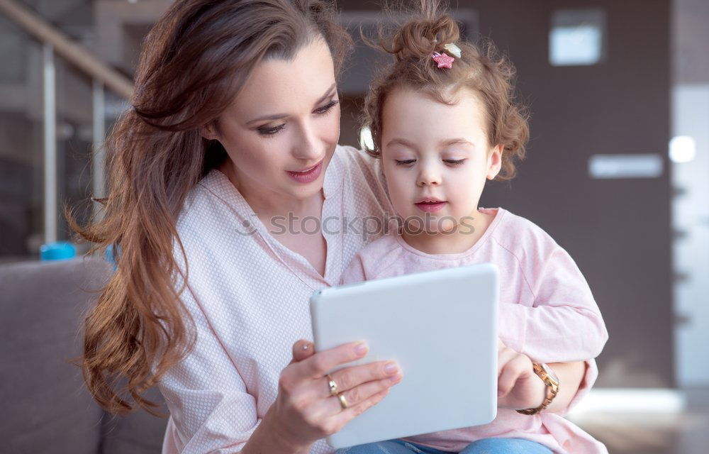 Similar – happy mother and toddler son using tablet