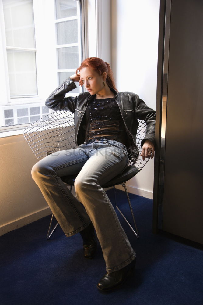 Similar – Image, Stock Photo Young woman sits on the couch and stretches out her long legs