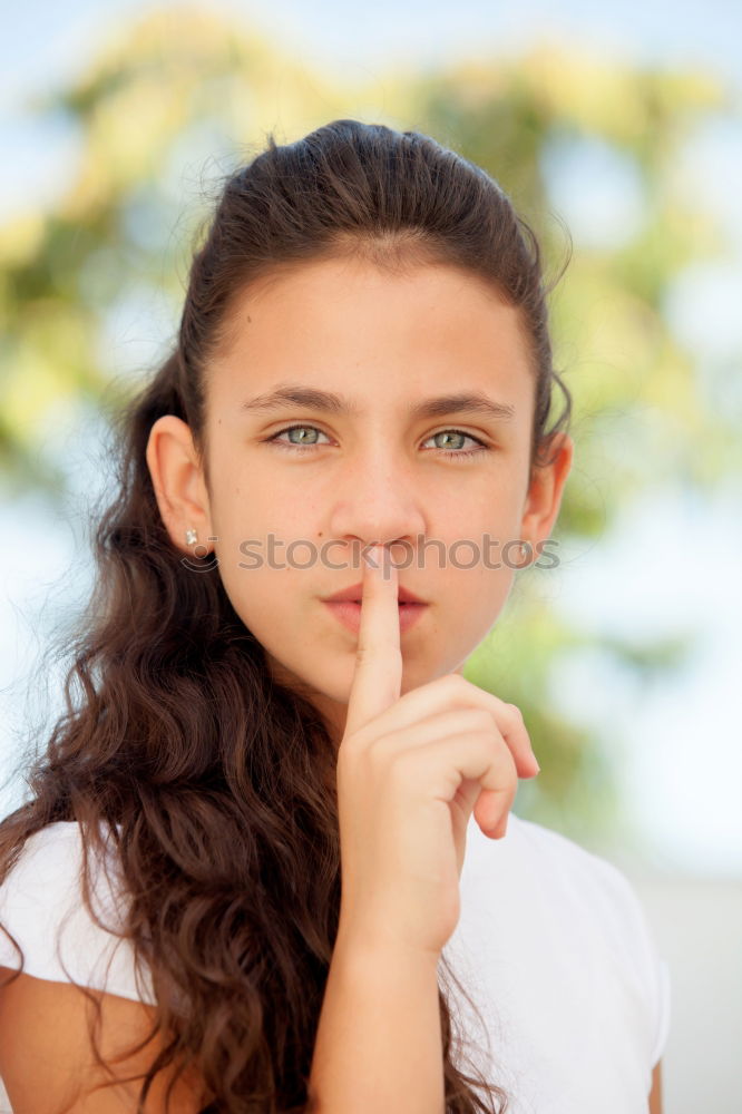 Similar – Young Girl Gesturing Silence.