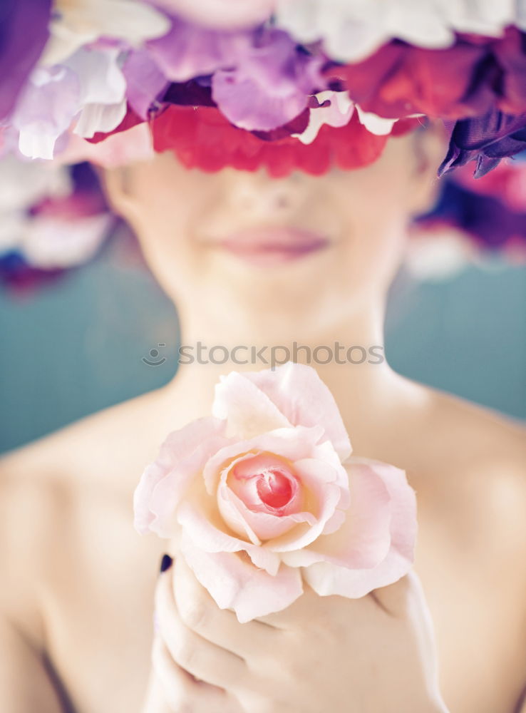 Similar – Young woman holding flowers in hand