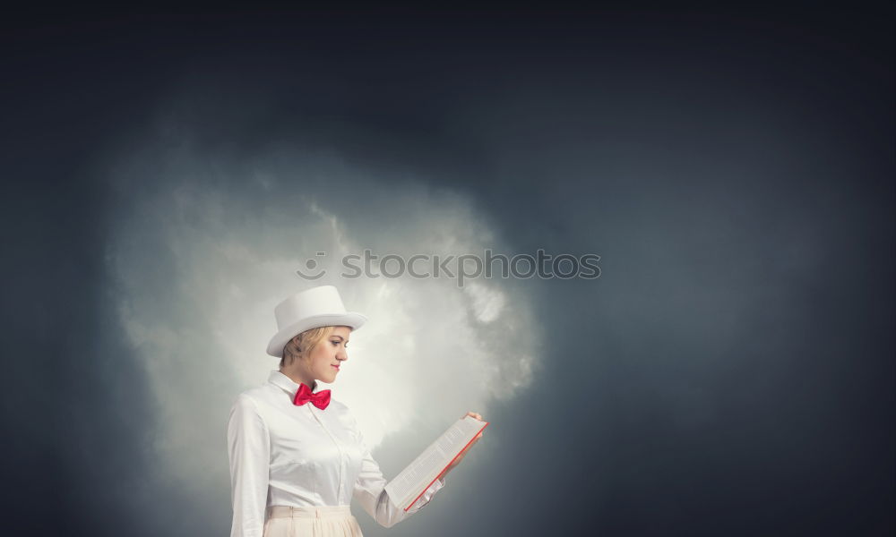 Similar – Hand holding cotton candy in front of wooden wall