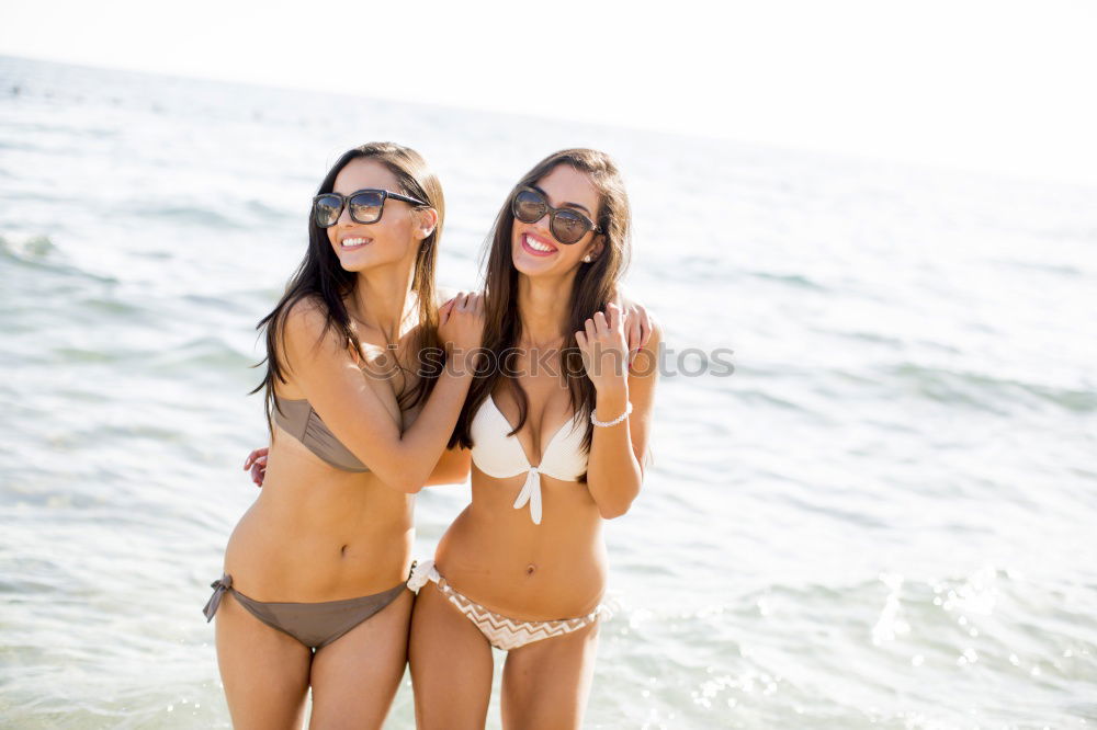 Image, Stock Photo Group of young woman having fun at the beach with surfboards