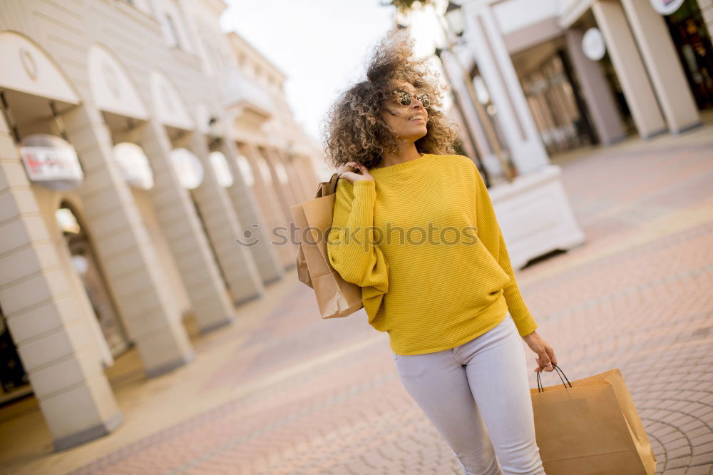 Similar – Image, Stock Photo Black woman, afro hairstyle, with shopping bags in the street