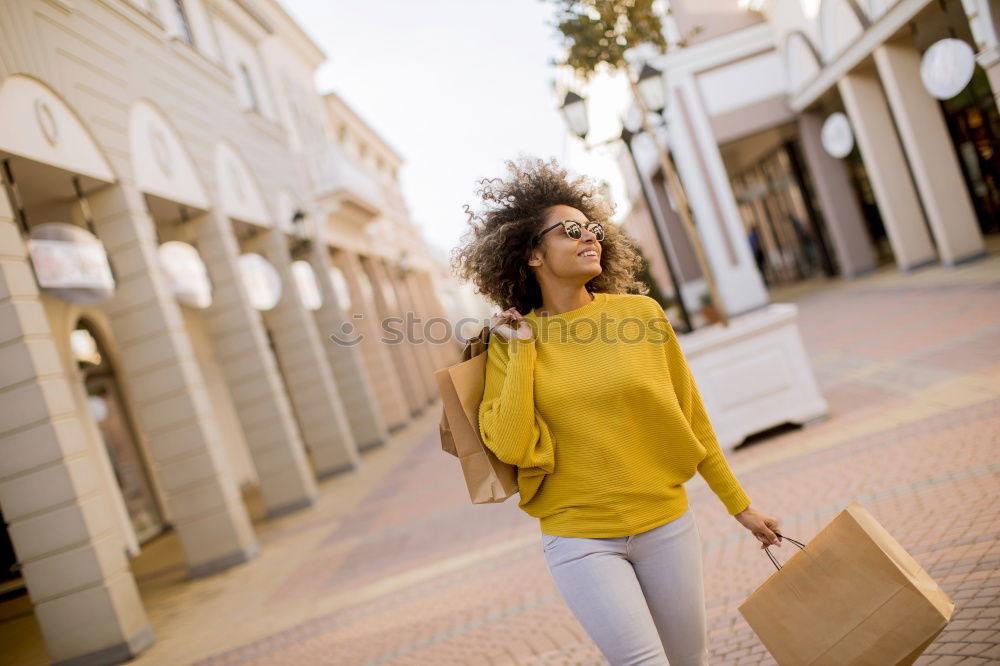 Similar – Image, Stock Photo Black woman, afro hairstyle, with shopping bags in the street