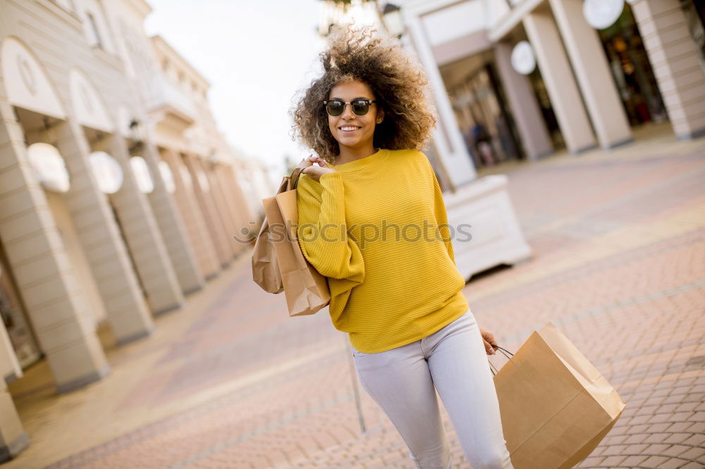 Similar – Image, Stock Photo Young black woman in front of a shop window in a shopping street