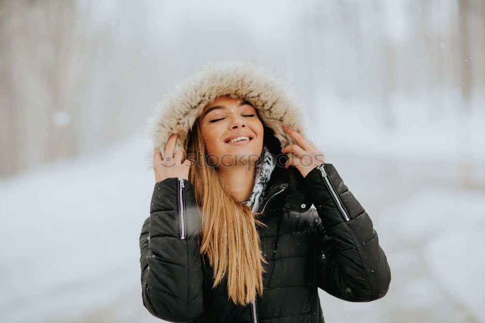 Similar – Young woman wrapped warm against the cold