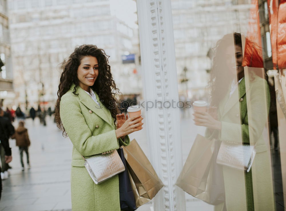 Similar – Image, Stock Photo Young black woman in front of a shop window in a shopping street