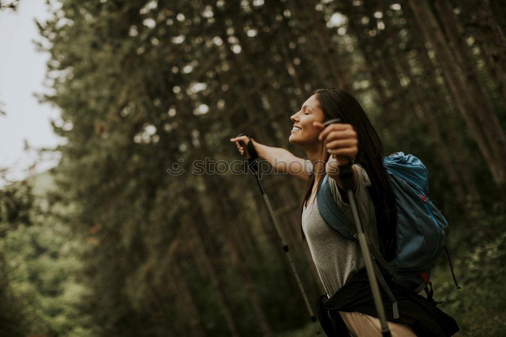 Similar – Woman hanging out of car in forest