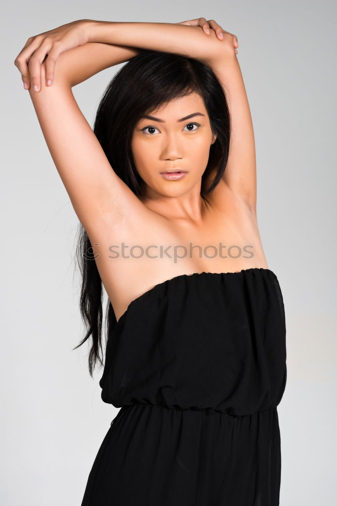 Image, Stock Photo Young Asian woman with posing in studio with hat