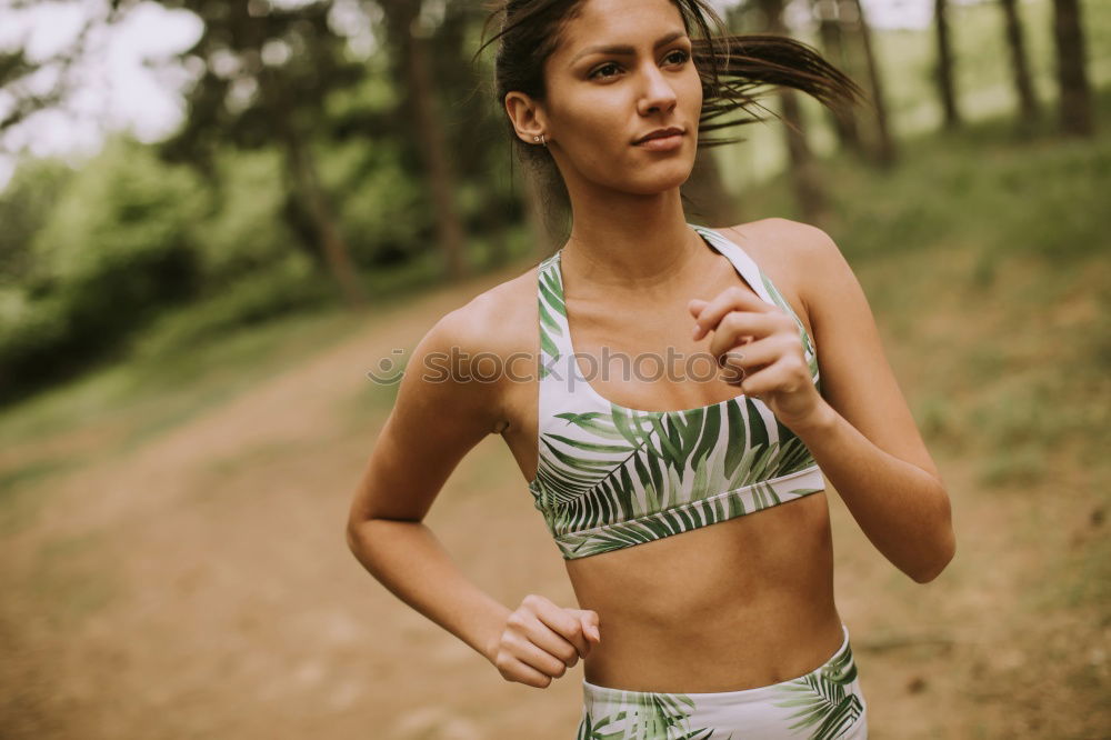 Image, Stock Photo Slim athletic woman jogging by the lake