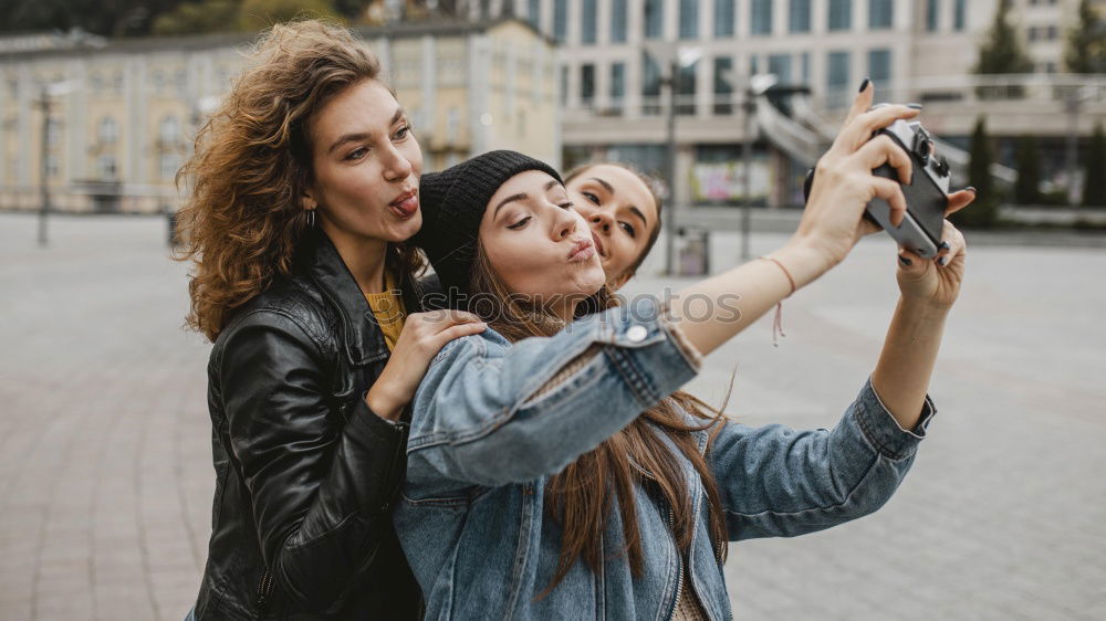 Similar – Image, Stock Photo Girl taking photo of her friend with smartphone