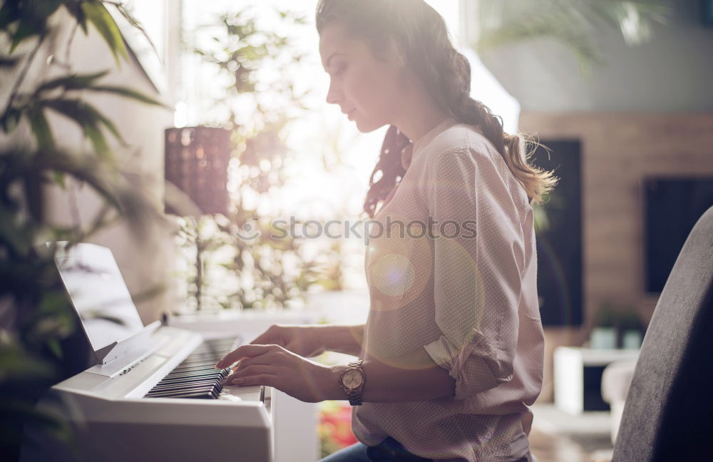 Similar – Young businesswoman working on laptop and drinking coffee