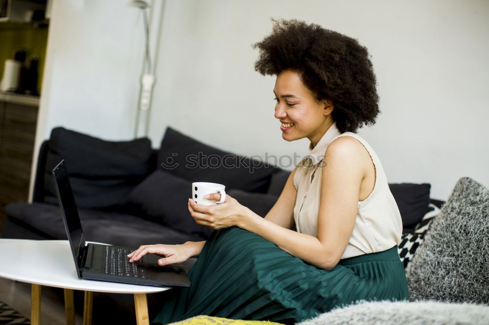 Similar – Beautiful afro american woman using mobile and laptop in the coffee shop.