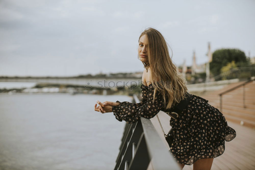 Similar – Beautiful young caucasian woman smiling in steps