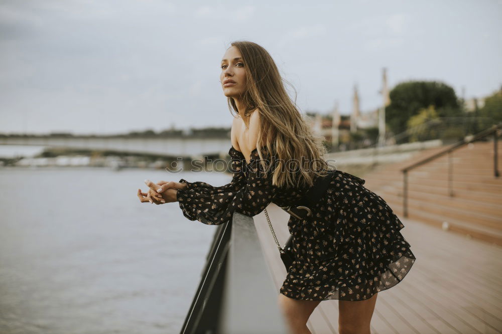 Similar – Beautiful young caucasian woman smiling in steps