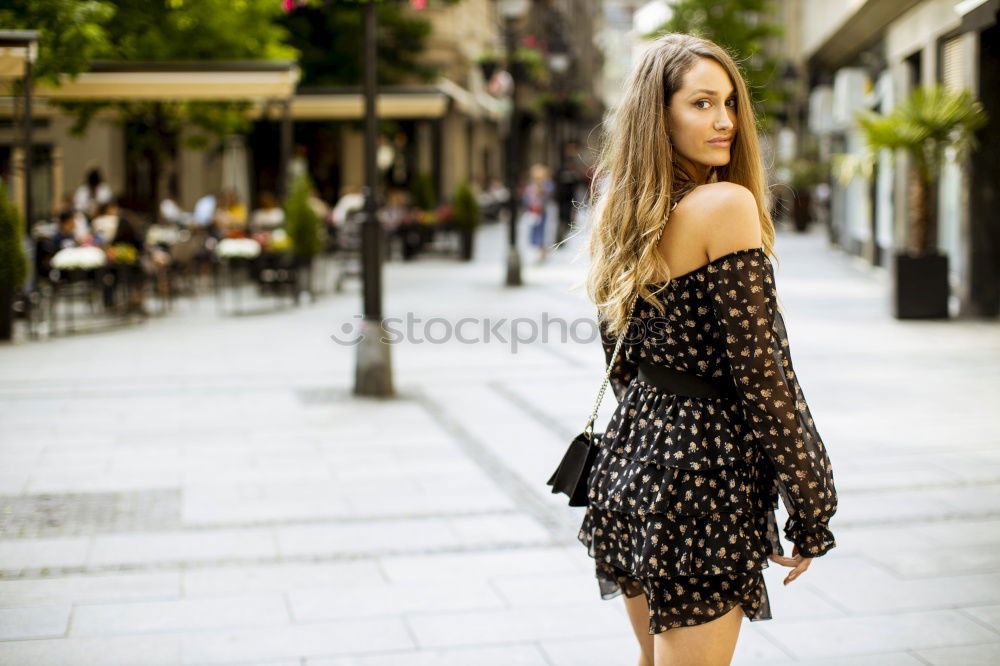 Similar – Smiling young woman in urban background.