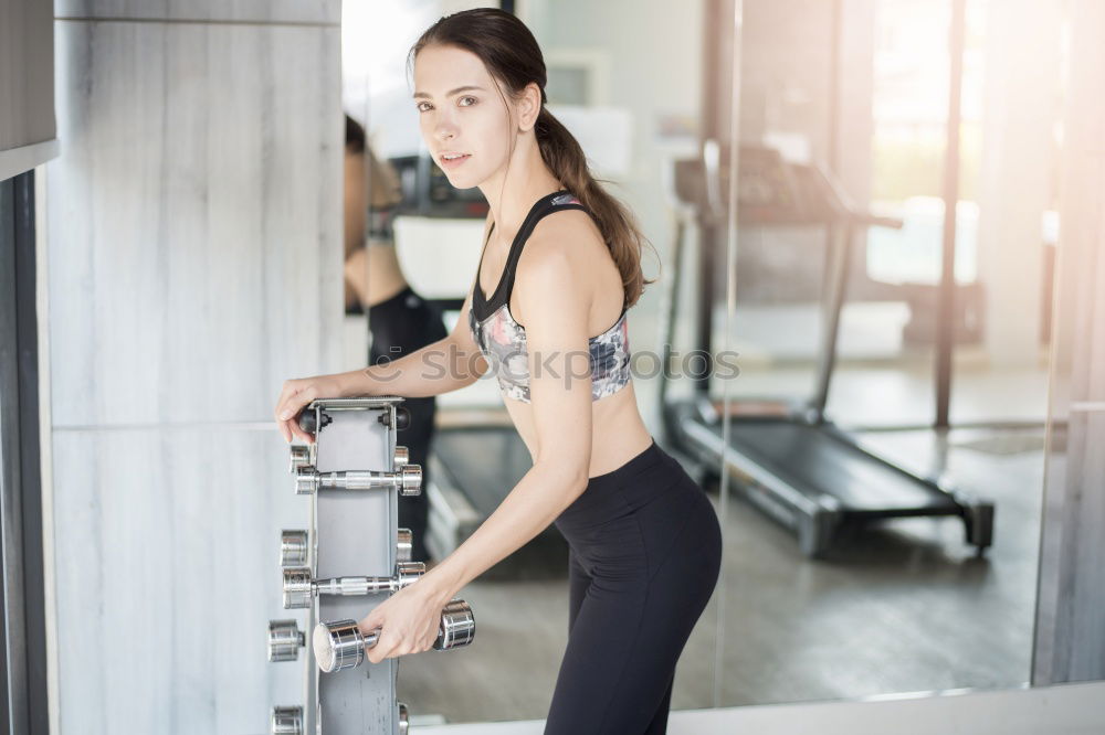Similar – Image, Stock Photo Sporty young woman sitting on forecourt with her mobile