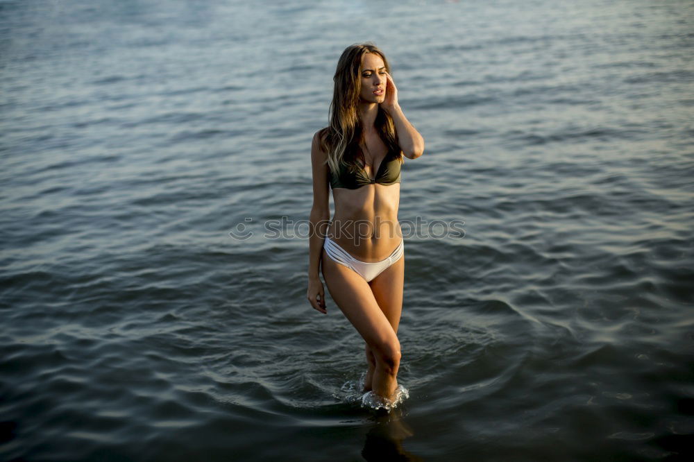 Similar – Image, Stock Photo Young woman in a colourful summer dress standing in the Rhine
