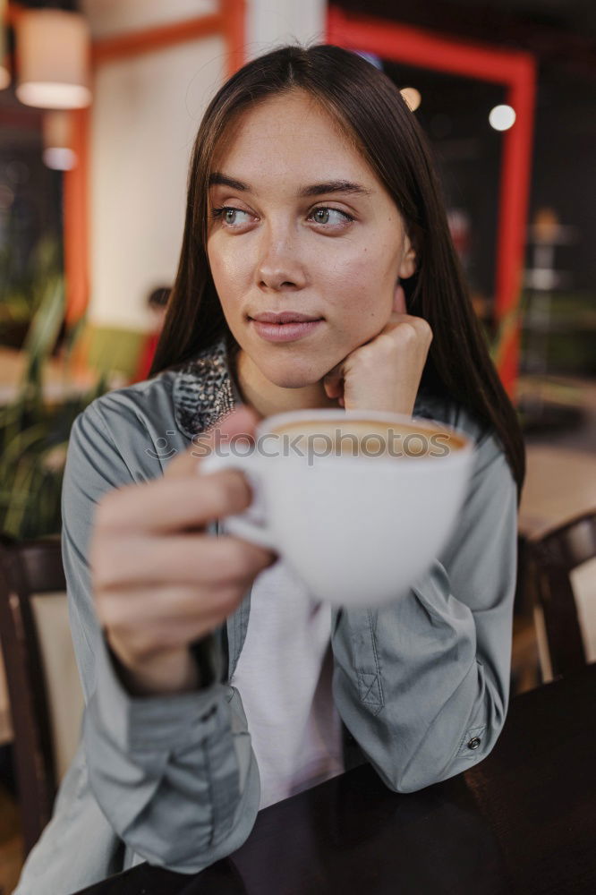 Similar – Image, Stock Photo Young woman having a coffee in a café