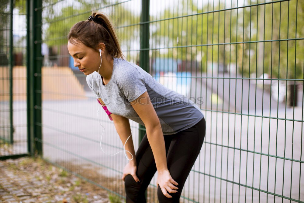 Similar – Image, Stock Photo Sportswoman doing leg stretches