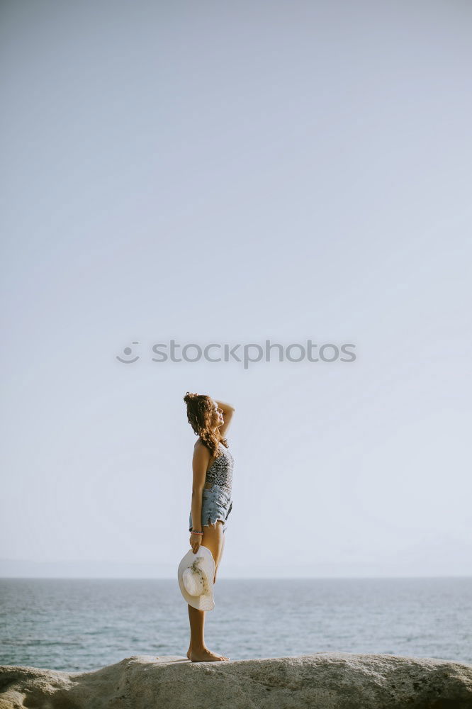 Similar – Image, Stock Photo Young adult couple kissing on beach after running workout