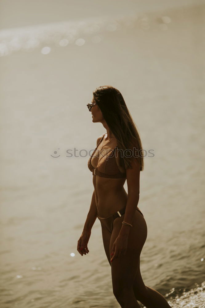 Similar – Image, Stock Photo Surfer girl on standing on the beach