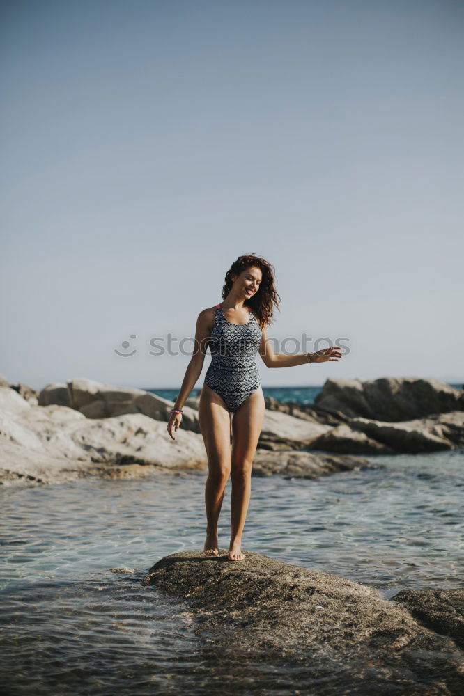 Similar – Image, Stock Photo Mixed Race female athlete resting after workout at the beach