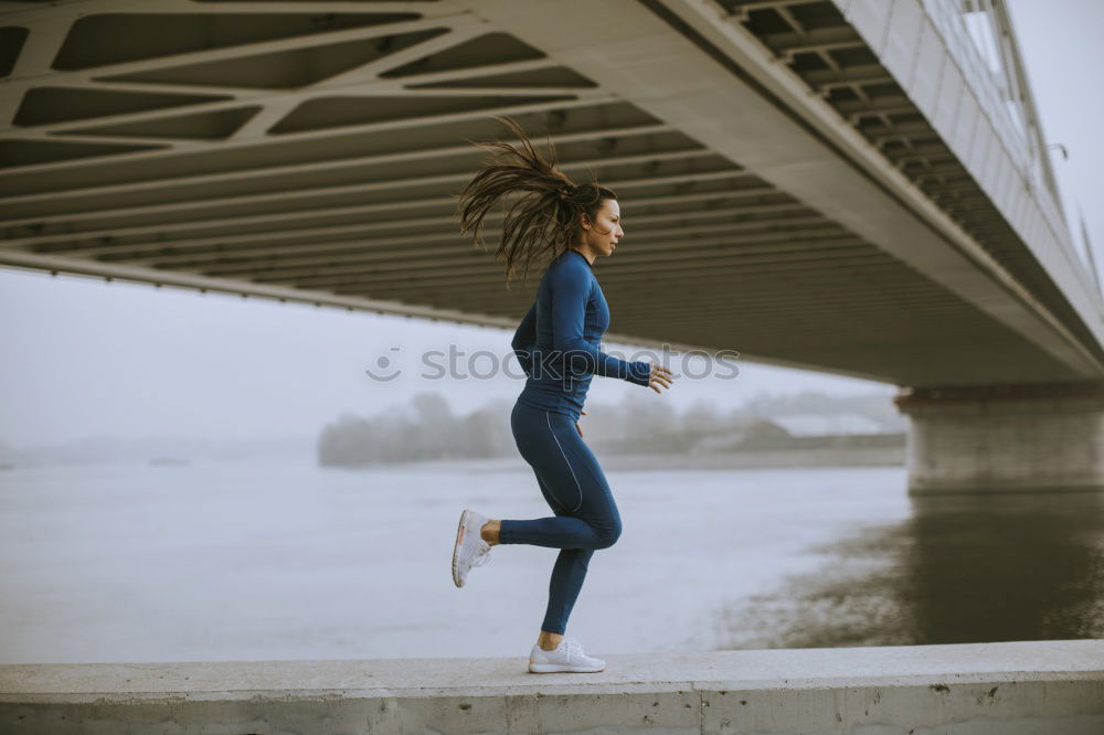 Similar – Young black woman doing stretching after running outdoors