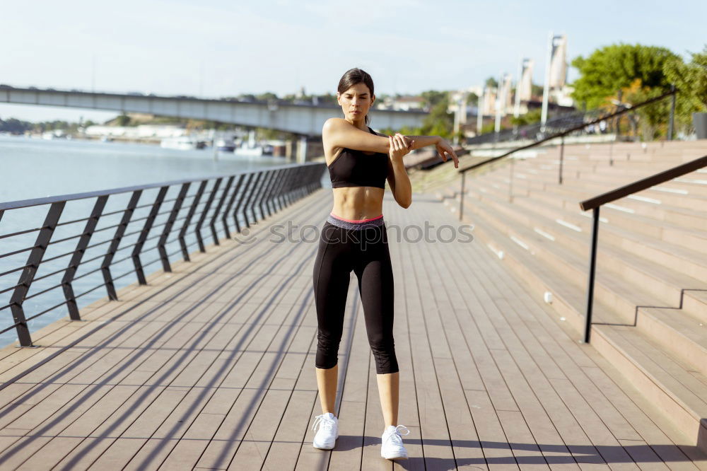 Similar – Smiling fit young woman doing stretching exercises