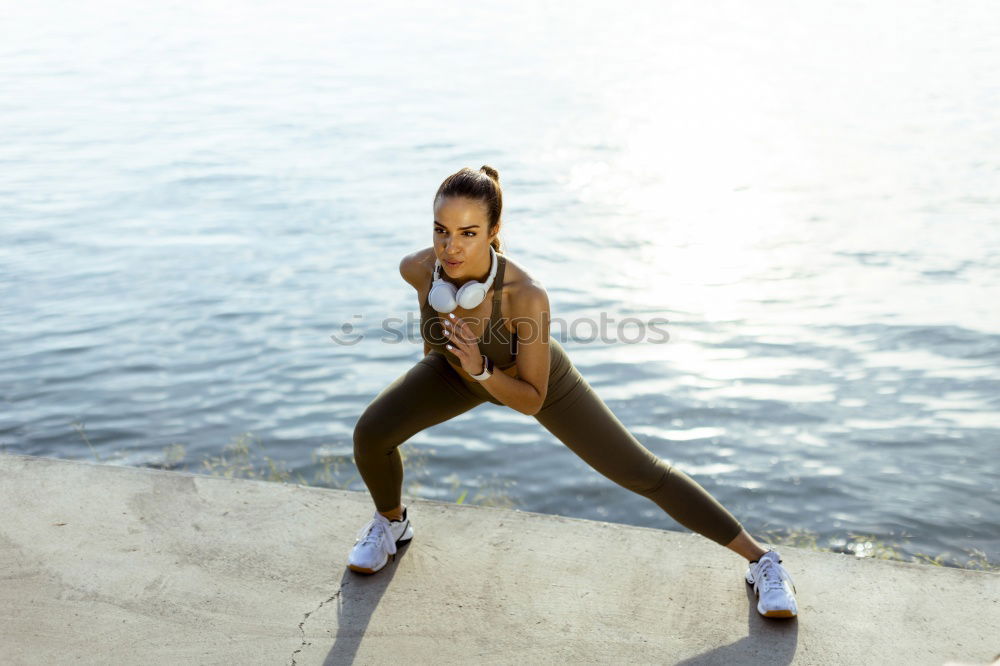 Similar – athletic woman doing her stretching routine