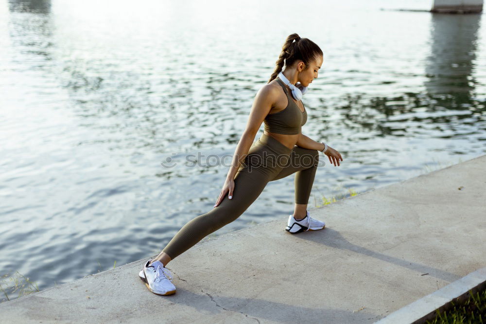 Similar – athletic woman doing her stretching routine