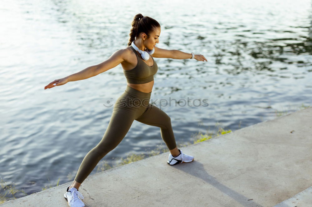 Similar – Young sporty woman doing exercises with a latex band