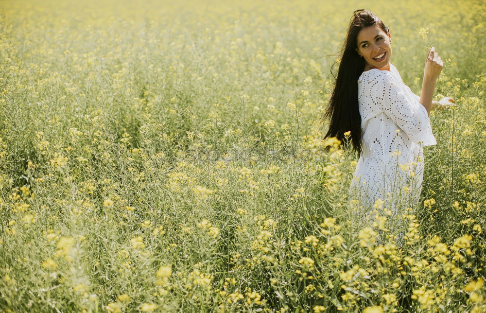 Similar – Pretty girl in youth summer sun with yellow nature flowers. Young woman is attractive, authentic and beautiful. Relaxation and peace from stress, love for environment and dream rest in soul full of happiness.