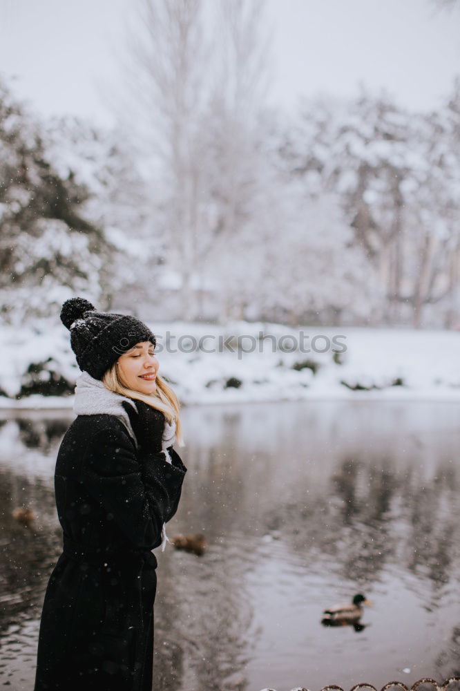 Similar – Image, Stock Photo Young black man is taking a walk outdoors in the winter