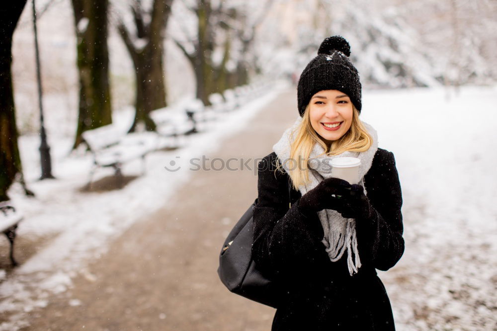 Similar – Young woman sitting on the street