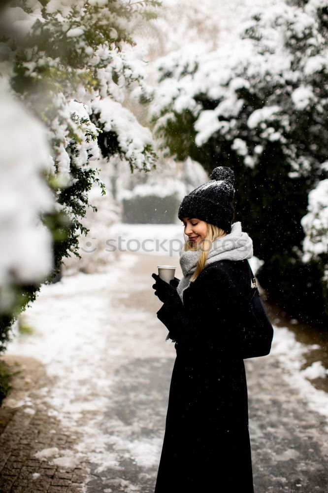 Similar – portrait Young pretty woman enjoying and playing with snow in winter