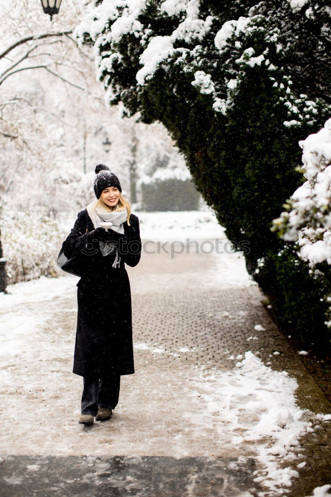 Similar – portrait Young pretty woman enjoying and playing with snow in winter