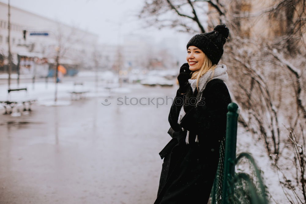 Similar – Young woman sitting on the street