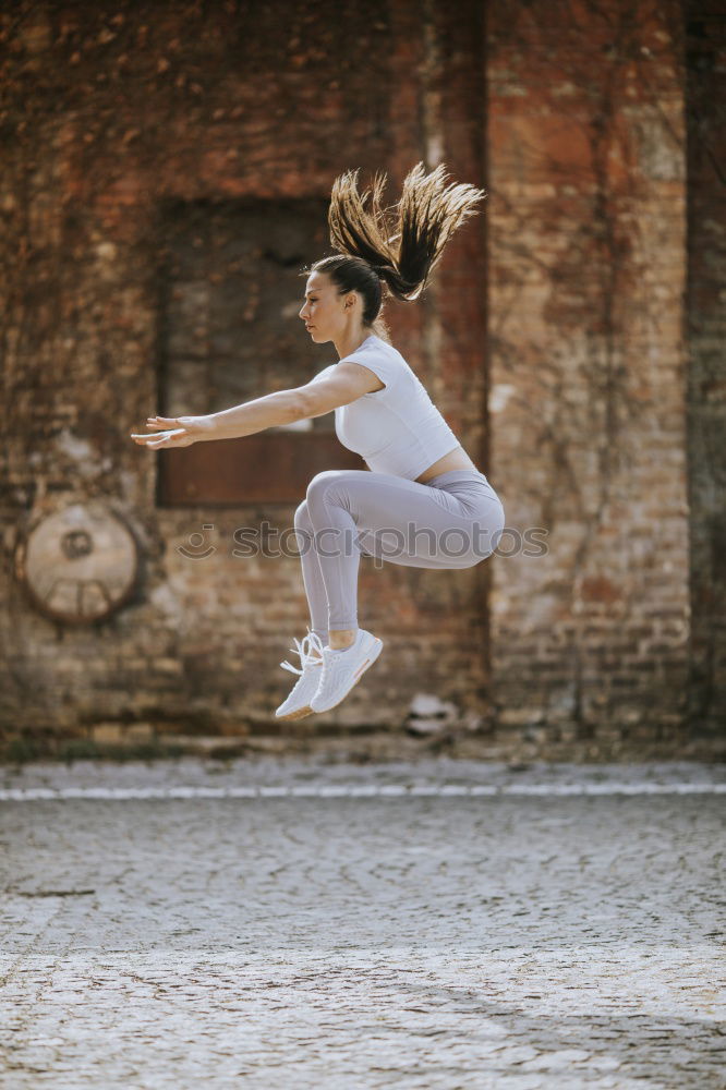 Similar – Image, Stock Photo Horizontal outdoors shot of a woman in the street performing a ballet.