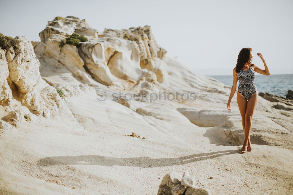 Similar – Image, Stock Photo Young naked woman holding man hand on shore near water