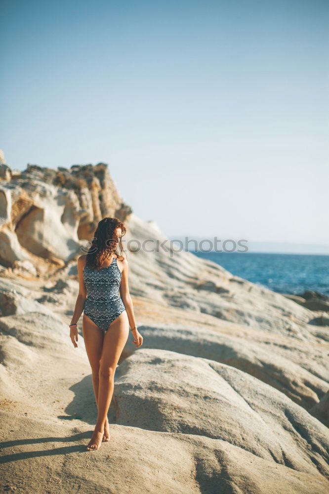 Similar – Image, Stock Photo Happy beautiful young woman with a swimming suit running in a wooden foot bridge at the beach