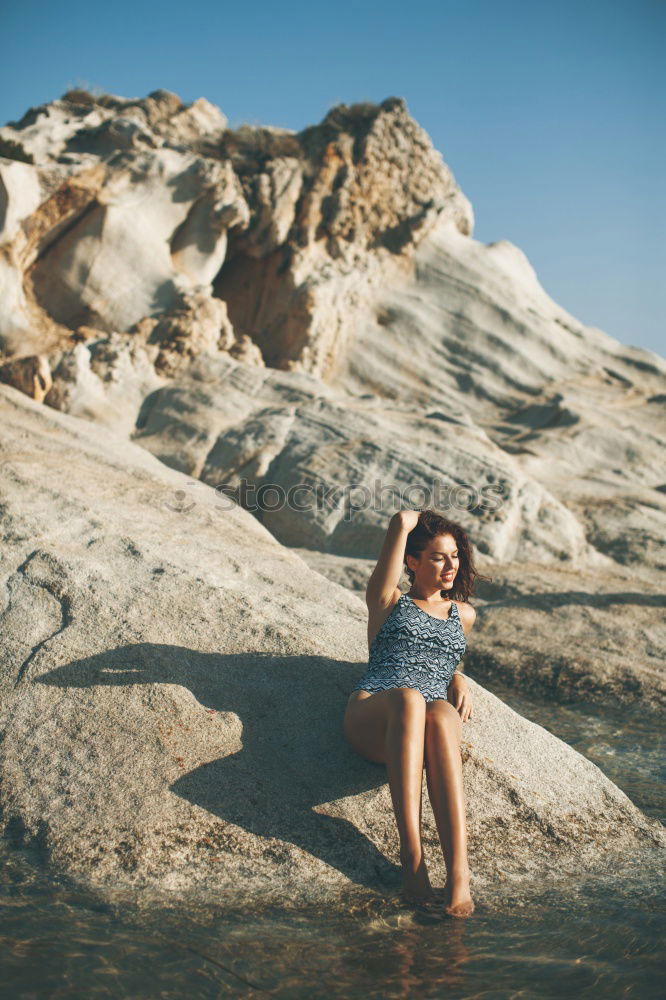 Similar – Happy girl posing on the stones of a river