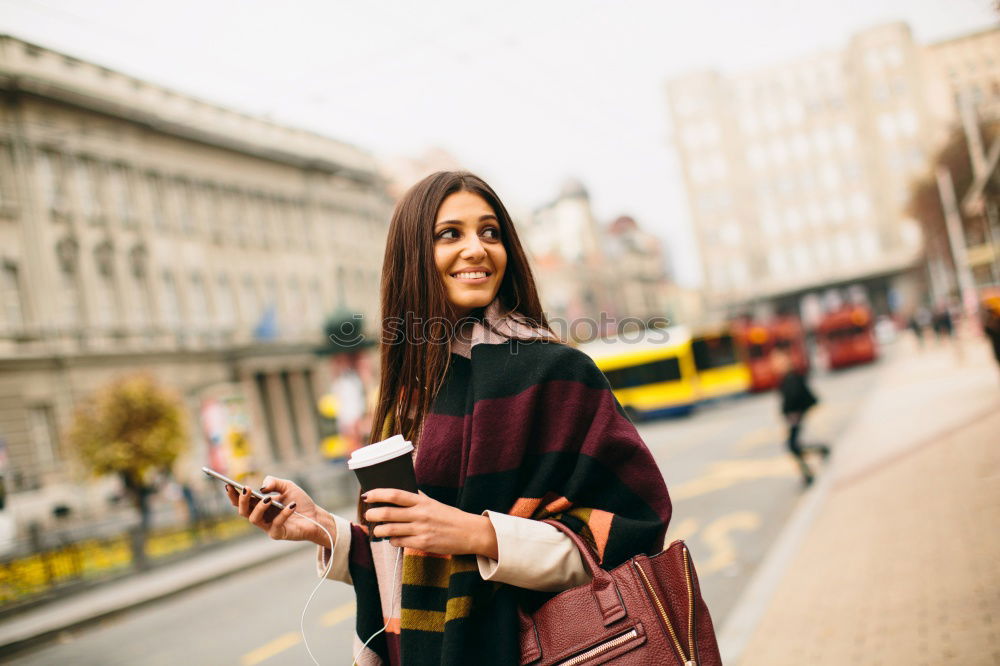 Similar – Young black woman drinking coffee wandering in the streets of Madrid on winter